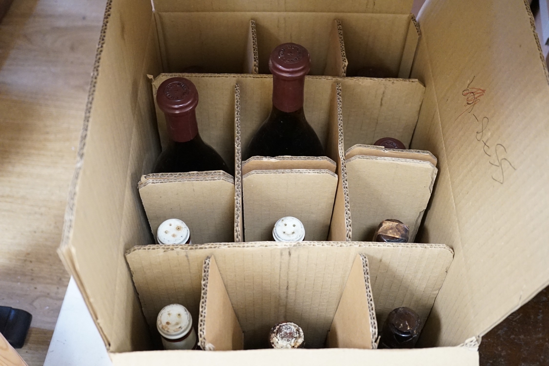 Eleven bottles of assorted wine, to include a magnum of limited edition maiden vintage 1983 Zevenwacht Cabernet Sauvignon, six bottles of 75cl 1976 Chateau de Pommard, and others, together with two bottles of port (13)